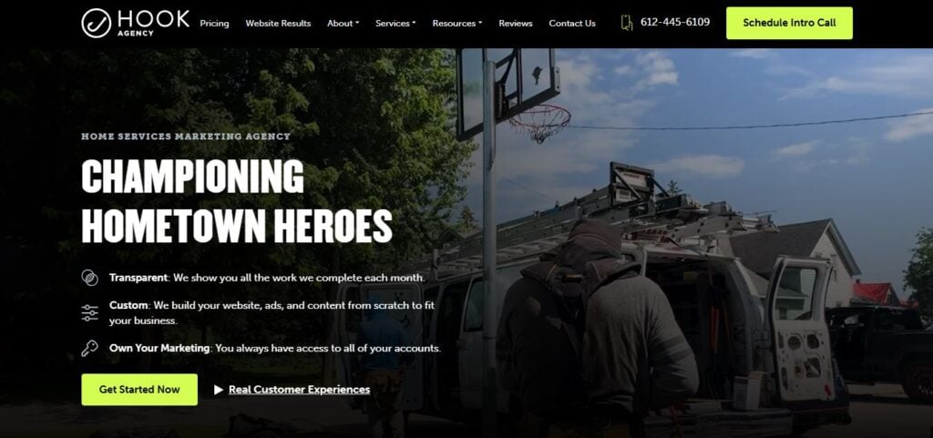 Hook Agency homepage with “Championing Hometown Heroes” slogan, workers on ladders, nav menus, and bold yellow “Schedule Intro Call” button.