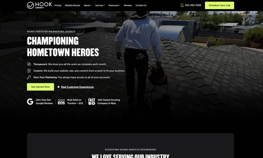 A professional in work attire and a wide-brim hat walks across a rooftop, carrying a red tool bag—demonstrating Hook Agency’s proven expertise as a leading HVAC marketing agency for home service businesses.