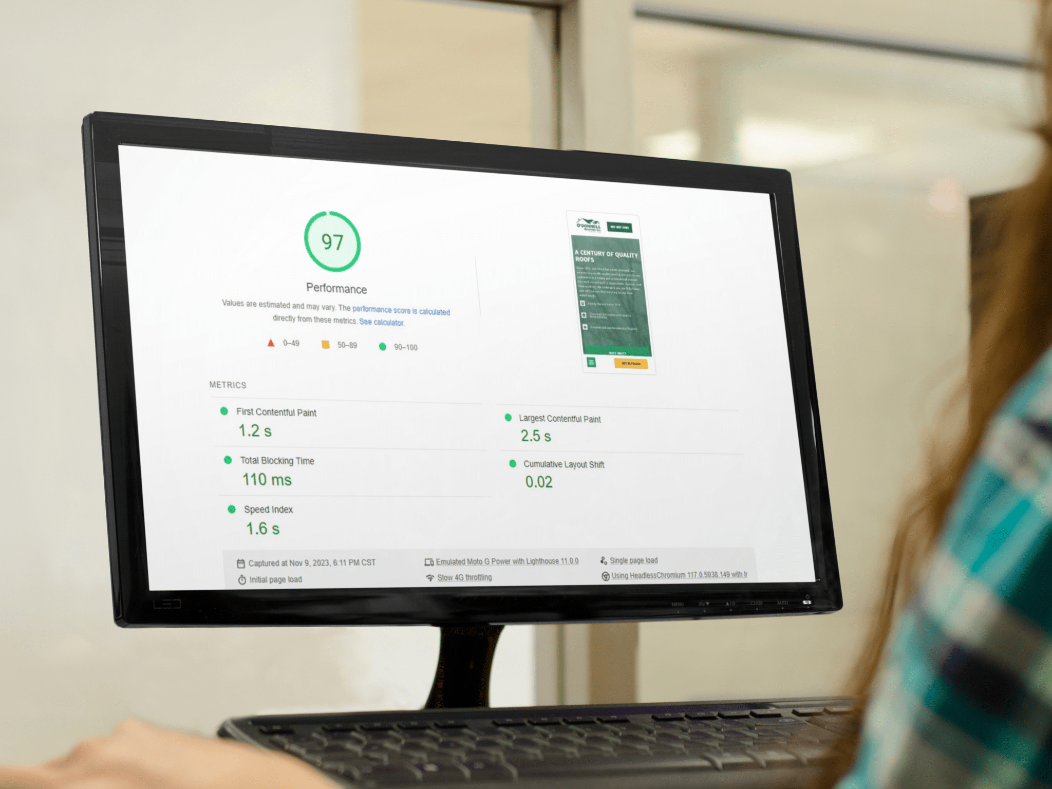 HVAC SEO Site Speed - On Hook Agency's website, a web performance report is displayed on a computer screen, showing an impressive score of 97. Key metrics such as First Contentful Paint, Speed Index, and Cumulative Layout Shift underscore our effective SEO strategies. The setting is a professional office environment.