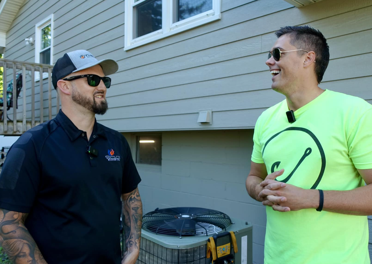 owner of Hook Agency next to client talking about lead generation strategies, how to get more leads from google through SEO, PPC, and effective website design, hvac guest posting for seo