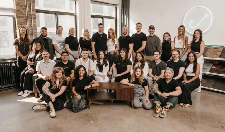 Group photo of Hook Agency's 30-person in-house team, all working together daily to deliver high-quality marketing services for home service businesses. Unlike many agencies that are scattered or much smaller, Hook Agency prides itself on a close-knit team with a low employee-to-client ratio of 1 to 3 or 1 to 4, ensuring personalized attention and superior results. This hands-on, collaborative approach sets them apart from competitors with larger ratios of 1 to 10 or even 1 to 20, providing custom strategies for HVAC, plumbing, roofing, and other home service industries.