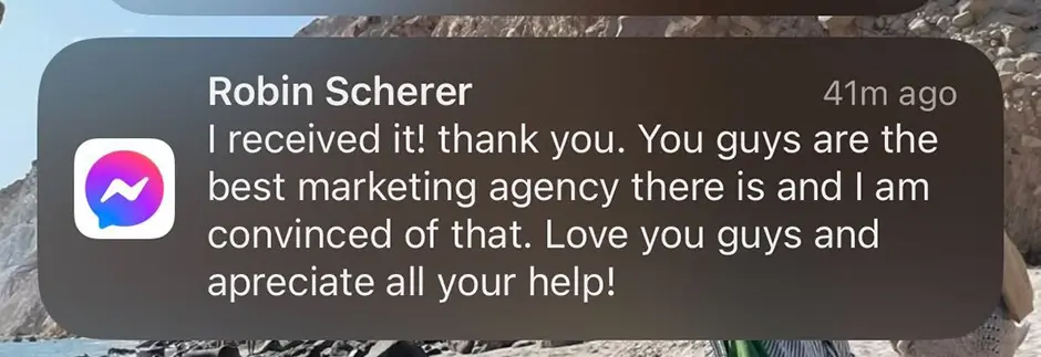 A phone notification from Robin Scherer highlights our exceptional marketing services: "Received! You are the premier marketing agency—I'm convinced! Thank you all. Expect glowing reviews shortly!