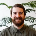 Headshot of Skyler McDaniel, who shares the success story of how Hook Agency, a leading marketing agency for home service businesses, helped scale a client’s business from under $1 million to $15 million in revenue through consistent SEO, targeted Google Ads, and custom website design. Skyler highlights how the agency's data-driven strategies, personalized marketing campaigns, and commitment to long-term growth helped transform this home service business into a market leader, underscoring the importance of effective digital marketing for HVAC, plumbing, and other home service industries.