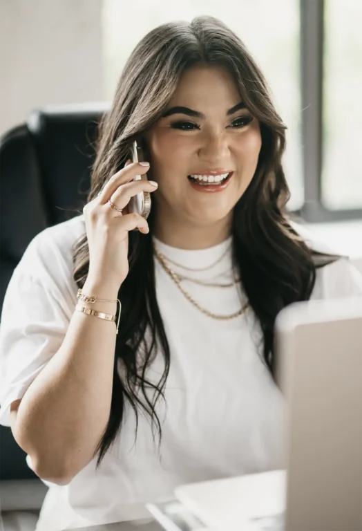 Sydnee, a sales person at Hook Agency, smiling while helping a potential client over the phone, representing the agency’s commitment to exceptional customer service. Like Progressive, Hook Agency assists people in finding the right solutions, whether or not they choose to work with the agency. This dedication to helping home service businesses, including HVAC, roofing, and plumbing companies, is why people love Hook Agency’s transparent, service-first approach to marketing.